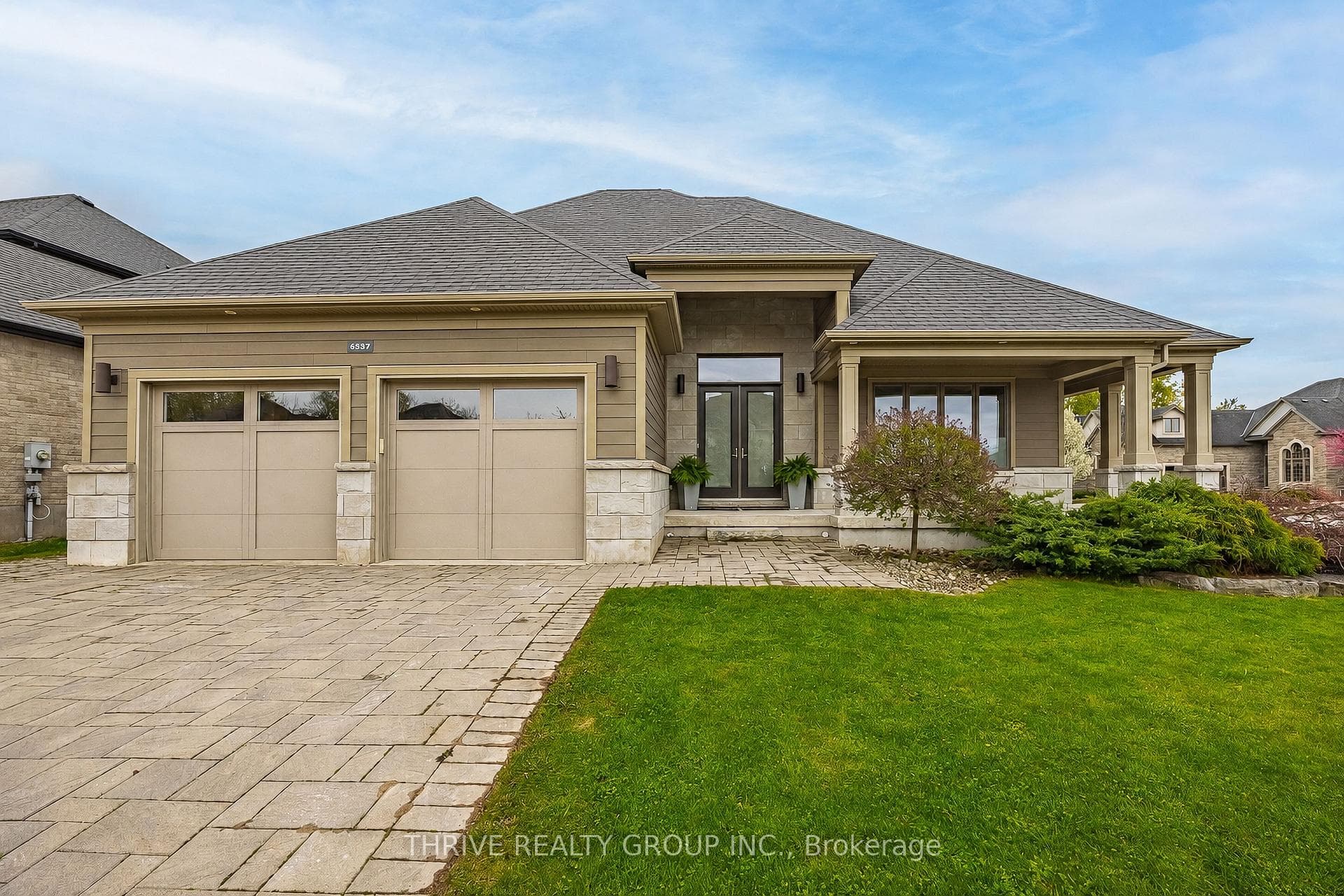 Front Elevation with double drive and landscaping