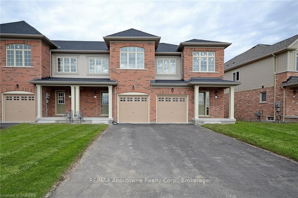 View of front of property featuring a garage and a