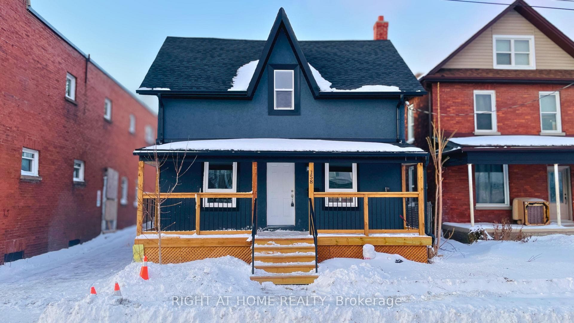 New Front Porch with Iron Rails & Stucco Exterior!