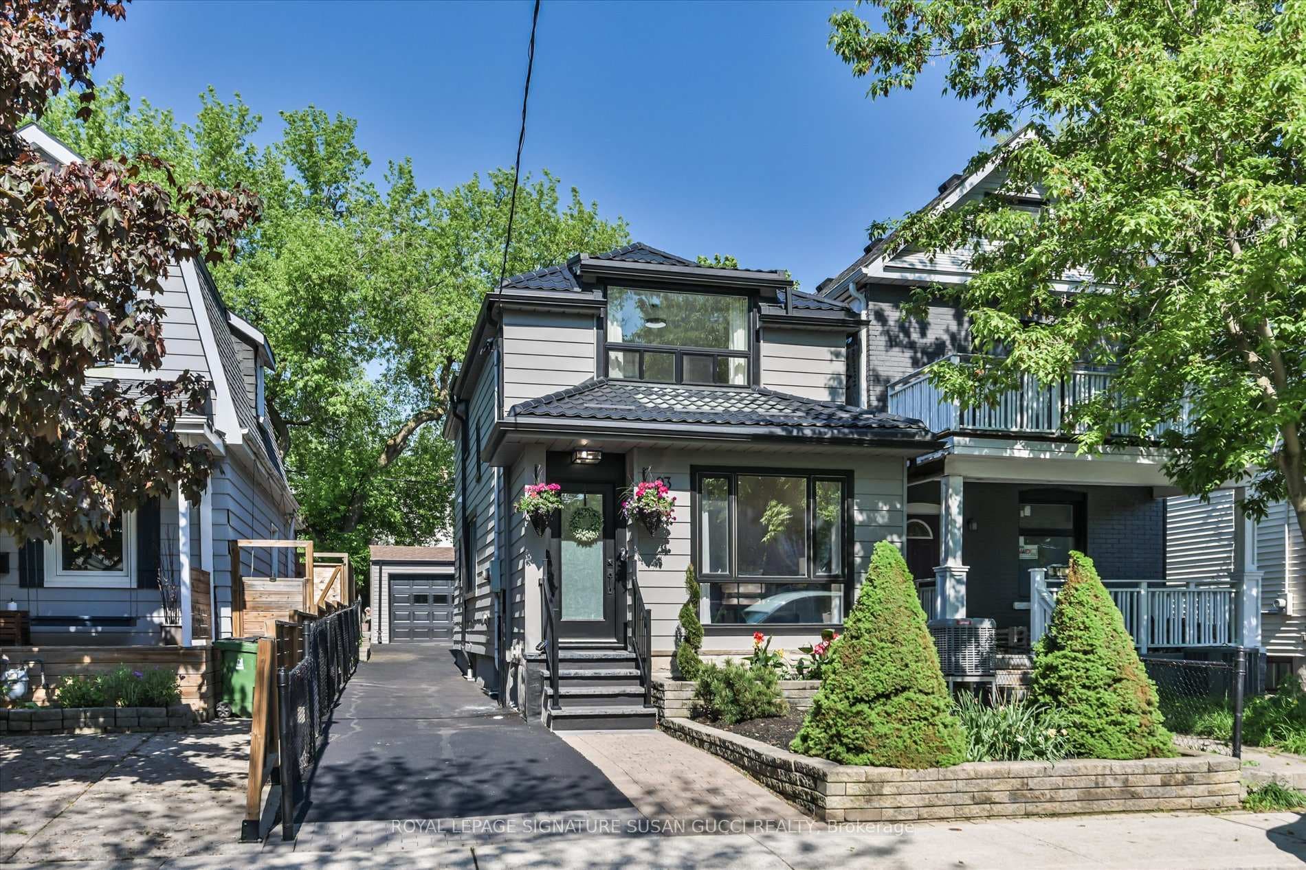 Stunning curb appeal with extra long private drive
