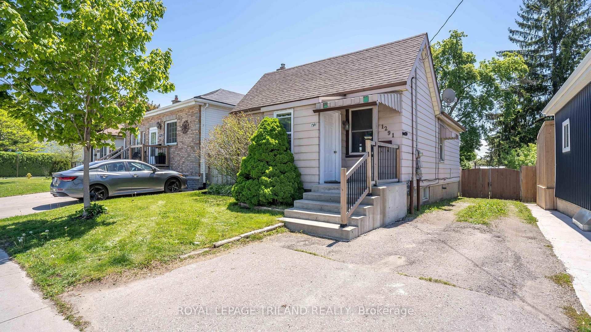 Front view of house with ample parking