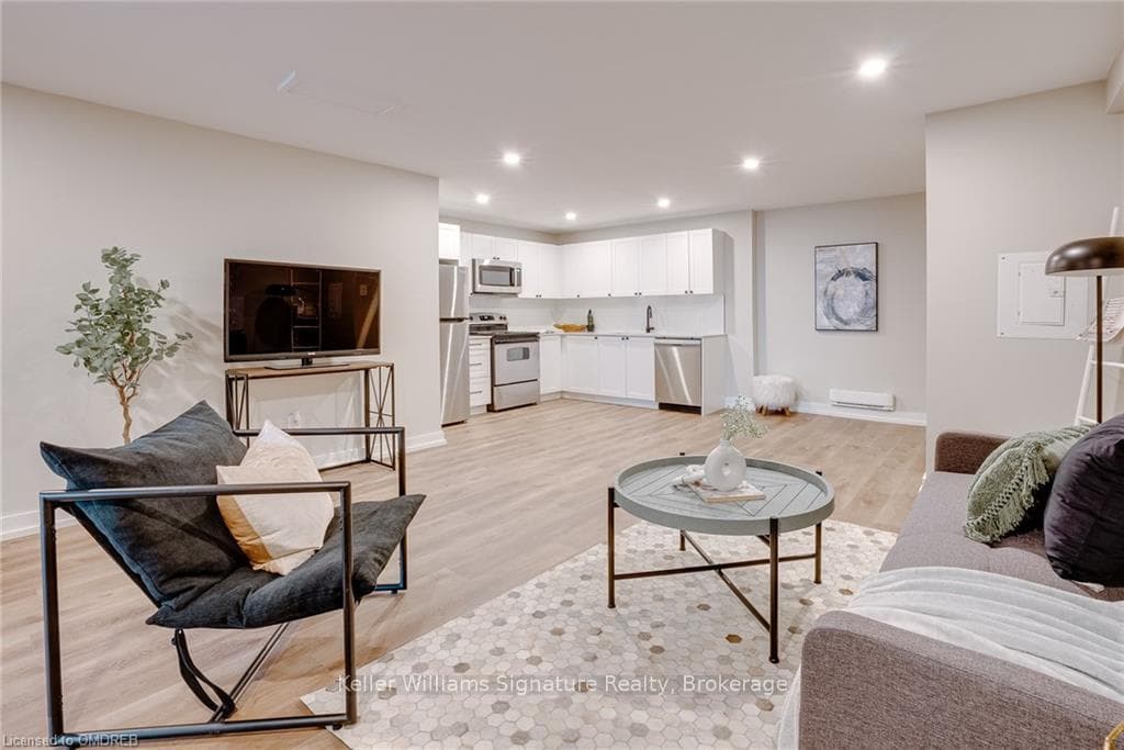 Living room with light wood-type flooring