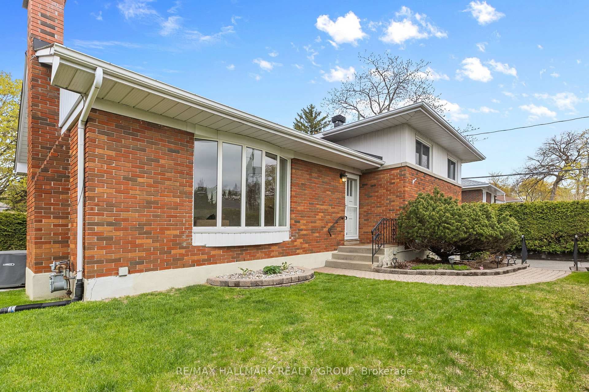 Welcoming front entrance with interlock walkway